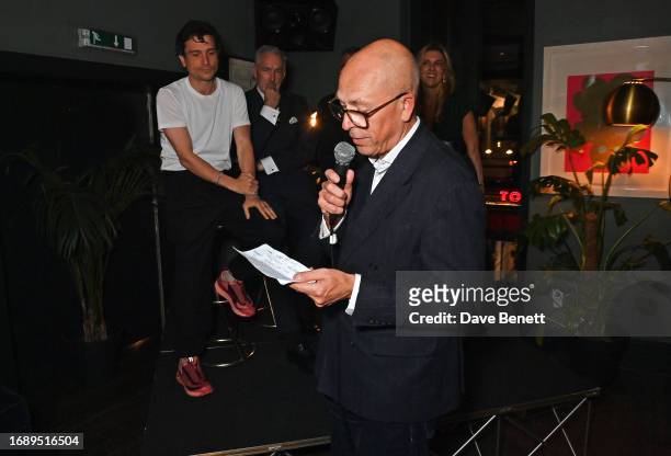Dylan Jones speaks as Jackson Boxer, Jeremy King and Christina Makris look on at the launch of 'The Art Of Dining: Celebrate London Restaurants' at...