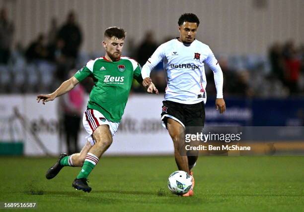 Louth , Ireland - 25 September 2023; Sam Durrant of Dundalk in action against Aaron Bolger of Cork City during the SSE Airtricity Men's Premier...