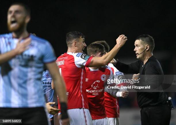 Dublin , Ireland - 25 September 2023; St Patrick's Athletic players remonstrate with referee David Dunne after he showed a red card to Sam Curtis...