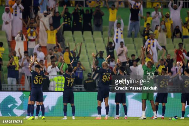 Al Nassr players celebrate victory with fans after King's Cup of Champions match between Ohod and Al Nassr at Prince Abdullah Al Faisal Stadium on...