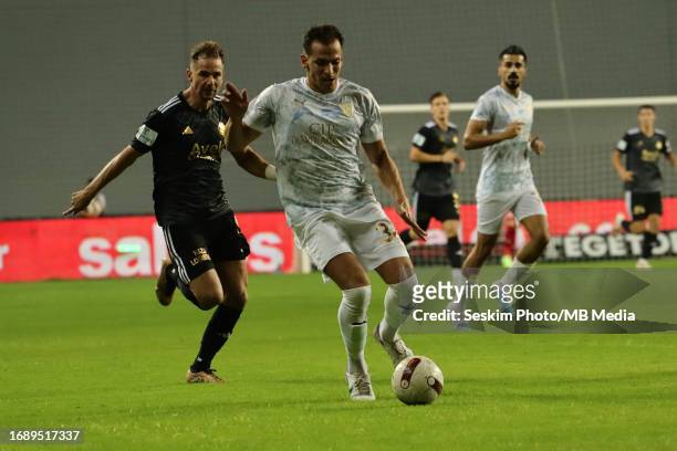 Tolga Unlu of Altay and Ali Aytemur of Bodrumspor battle for the ball during the TFF 1.st League match between Altay and Bodrumspor at Alsancak...