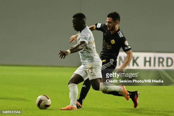 Salih Sarikaya of Altay and Aldair Adulai Djalo Balde of Bodrumspor battle for the ball during the TFF 1.st League match between Altay and Bodrumspor...