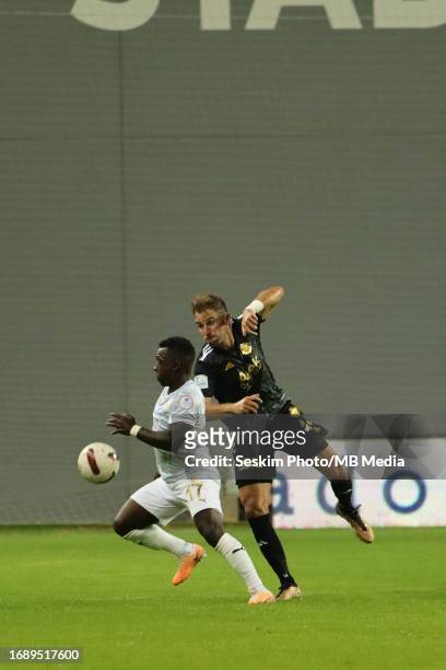 Tolga Unlu of Altay and Aldair Adulai Djalo Balde of Bodrumspor battle for the ball during the TFF 1.st League match between Altay and Bodrumspor at...
