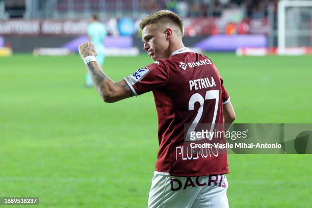 Claudiu Petrila of Rapid Bucuresti celebrates after scoring a goal during the SuperLiga Round 10 match between Rapid Bucuresti and CFR Cluj at...