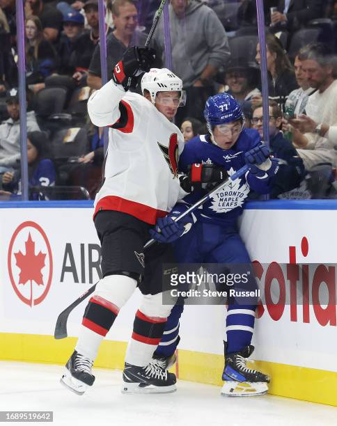 Ottawa Senators right wing Vladimir Tarasenko checks Toronto Maple Leafs forward Ryan Tverberg as the Toronto Maple Leafs play the Ottawa Senators in...
