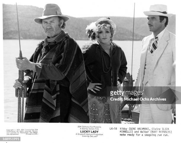 Gene Hackman, Liza Minnelli and Burt Reynolds go fishing in a scene from the film 'Lucky Lady', 1975.