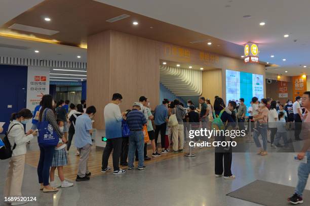 Patients line up for an emergency pre-check at the new pediatric building of Xinhua Hospital in Shanghai, China, On the night of September 25, 2023....