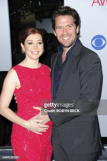 Alyson Hannigan and Alexis Denisof arrive for the 2012 People's Choice Awards at the Nokia Theatre in Los Angeles, California, January 11, 2012. AFP...