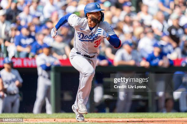 Amed Rosario of the Los Angeles Dodgers runs towards first base during the game between the Los Angeles Dodgers and the Seattle Mariners at T-Mobile...