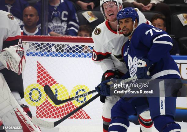 Toronto Maple Leafs right wing Ryan Reaves battles for position with Ottawa Senators defenseman Maxence Guenette as the Toronto Maple Leafs fall to...