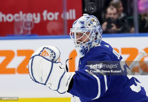 The puck flies over Toronto Maple Leafs goaltender Martin Jones as he makes a save as the Toronto Maple Leafs fall to the Ottawa Senators 4-3 in...