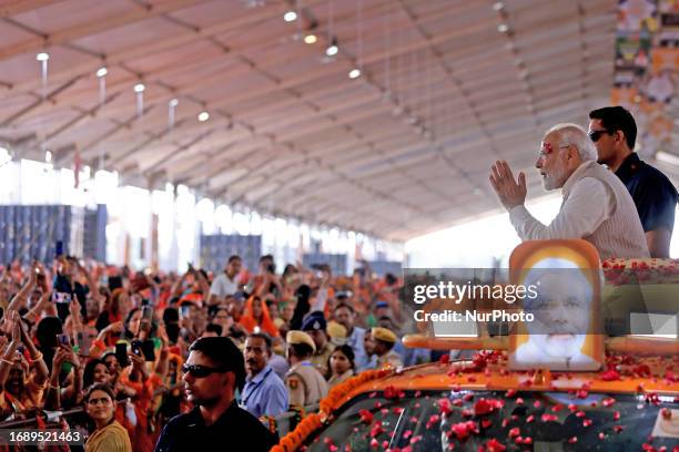 Prime Minister Narendra Modi exchanges greetings as he arrives for the 'Parivartan Sankalp Mahasabha ' at Dadiya village in Jaipur, Rajasthan, India,...