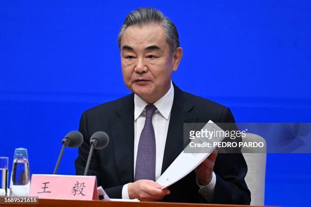Chinese Foreign Minister Wang Yi attends a press conference at the state council information office in Beijing on September 26, 2023.