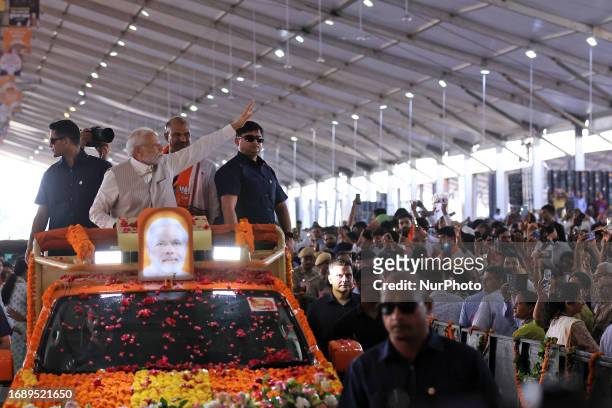 Prime Minister Narendra Modi exchanges greetings as he arrives for the 'Parivartan Sankalp Mahasabha ' at Dadiya village in Jaipur, Rajasthan, India,...