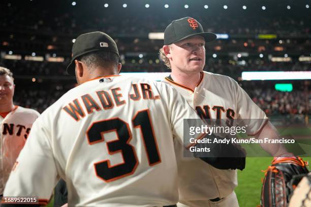Logan Webb and LaMonte Wade Jr. #31 of the San Francisco Giants in a game against the San Diego Padres at Oracle Park on September 25, 2023 in San...