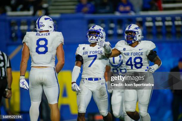 Happy Air Force DE Bo Richter and DE Jayden Thiergood celebrate Air Force FS Trey Taylor after his interception late in the game between the Air...