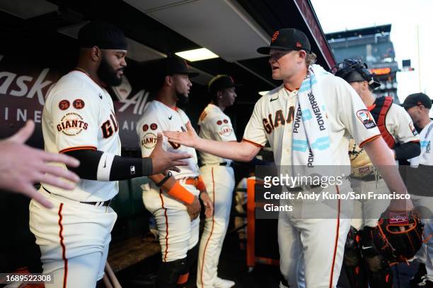 Logan Webb and Heliot Ramos of the San Francisco Giants before a game against the San Diego Padres at Oracle Park on September 25, 2023 in San...
