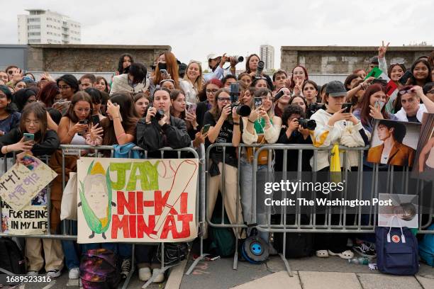 Fans of K-pop group Enhypen at the Prada fashion show during Milan Fashion Week, September 21 2023.