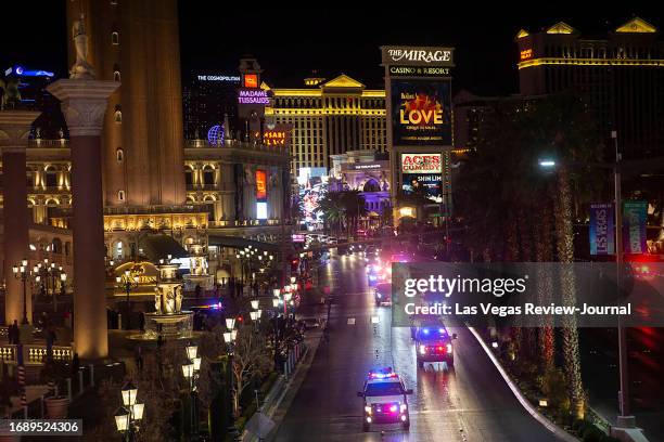 President Donald Trump's motorcade drives north on the Las Vegas Strip outside The Venetian with an escort from Las Vegas police on Wednesday, Feb....