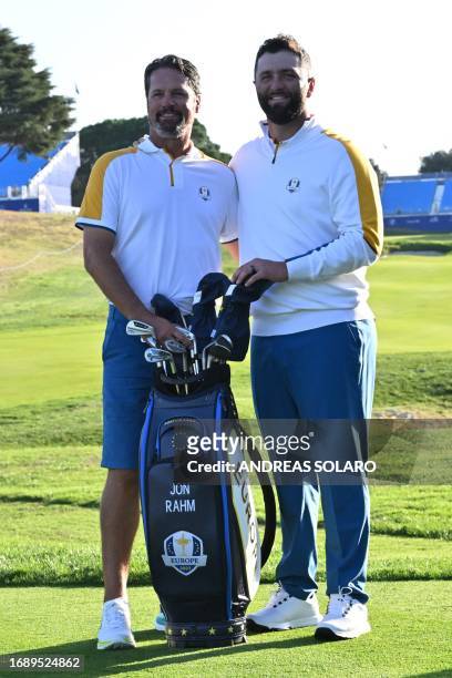 Europe's Spanish golfer, Jon Rahm and caddie, Adam Hayes pose during the European team official team portraits ahead of the 44th Ryder Cup at the...