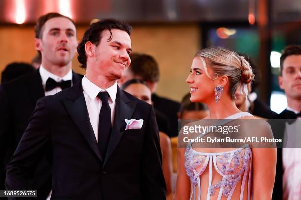 Daniel Rioli of the Tigers and partner Paris Lawrence arrive during the 2023 Brownlow Medal at Crown Palladium on September 25, 2023 in Melbourne,...