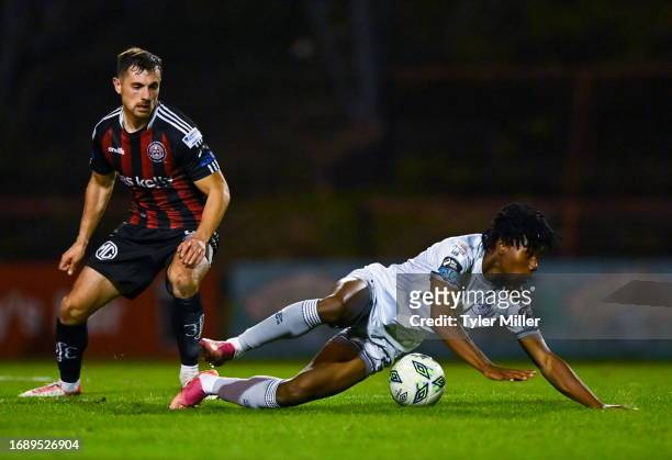 Dublin , Ireland - 25 September 2023; Gbemi Arubi of Shelbourne is tackled by Jordan Flores of Bohemians during the SSE Airtricity Men's Premier...