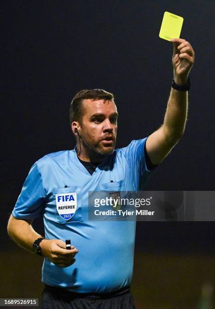 Dublin , Ireland - 25 September 2023; Referee Robert Harvey shows a yellow card to Gavin Molloy of Shelbourne during the SSE Airtricity Men's Premier...