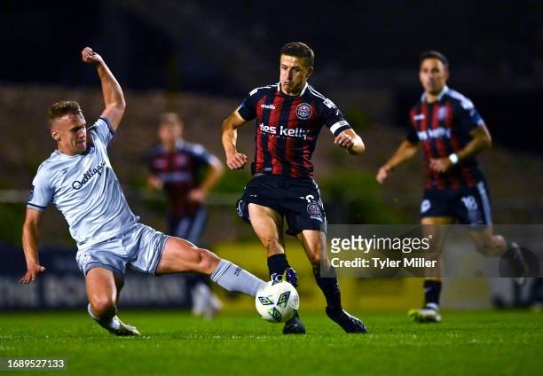 Dublin , Ireland - 25 September 2023; Keith Buckley of Bohemians is tackled by Brian McManus of Shelbourne during the SSE Airtricity Men's Premier...