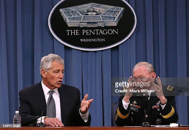 Secretary of Defense Chuck Hagel and Chairman of the Joint Chiefs of Staff Gen. Martin E. Dempsey speak to the media during a media briefing at the...