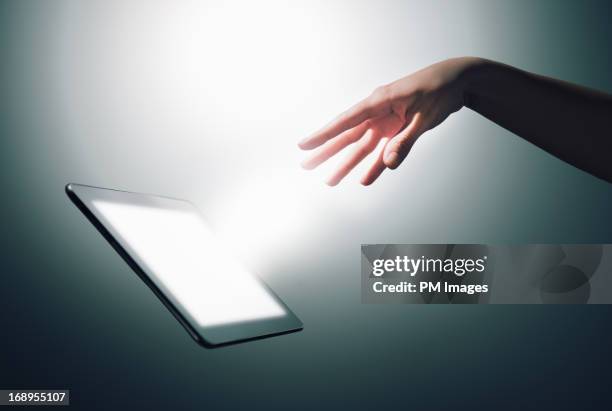 hand commanding digital tablet - gesturing stock pictures, royalty-free photos & images