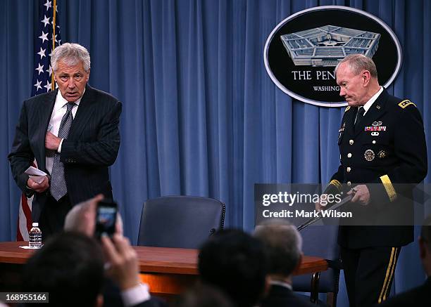 Secretary of Defense Chuck Hagel and Chairman of the Joint Chiefs of Staff Gen. Martin E. Dempsey arrive at a media briefing at the Pentagon, May 17,...