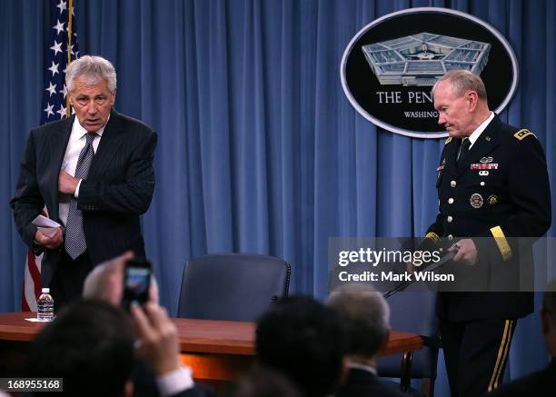 Secretary of Defense Chuck Hagel and Chairman of the Joint Chiefs of Staff Gen. Martin E. Dempsey arrive at a media briefing at the Pentagon, May 17,...