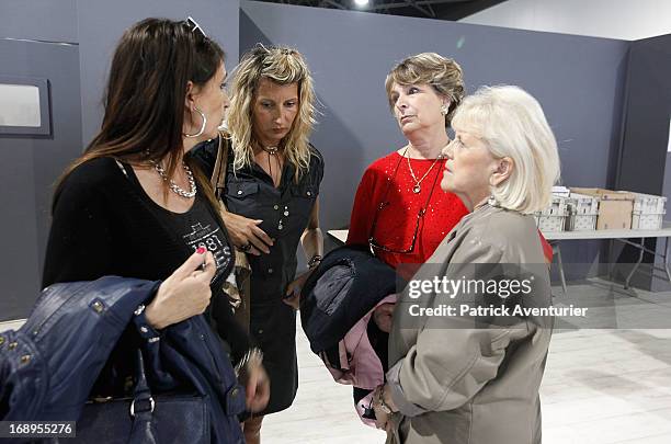 Plaintiffs stand outside the courthouse on the last day of the PIP trial at Parc Chanot on May 17, 2013 in Marseille, France. Jean-Claude Mas and his...