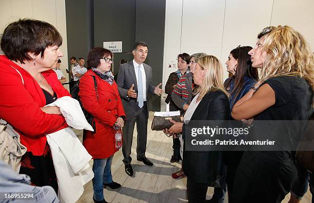 Marseille's prosecutor Jacques Dallest speaks with a plaintiff during the last day of the PIP trial at Parc Chanot on May 17, 2013 in Marseille,...