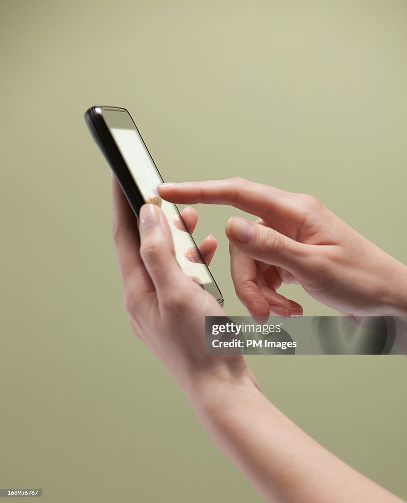 Woman's hands using smart phone