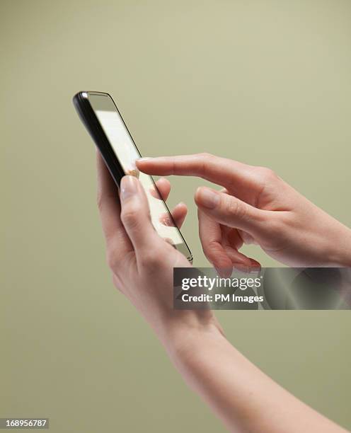 Phone Ini Hand 7,426 Phone In Hand Studio Stock Photos, High-Res Pictures, and Images ...