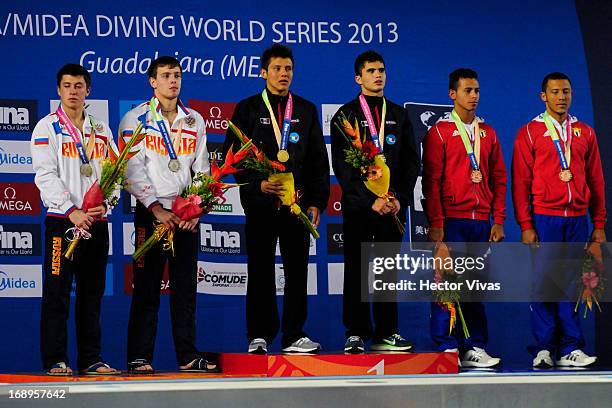 Victor Minibaev and Artem Chesakov from Russia pose with a silver medal, German Sanchez and Ivan Garcia from Mexico pose with a gold medal and, Jose...