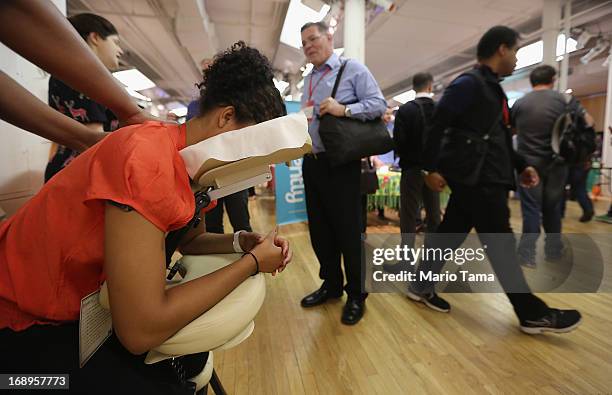 Woman receives a massage while attending the NYC Uncubed tech recruiting event on May 17, 2013 in New York City. 1,100 people were expected to attend...