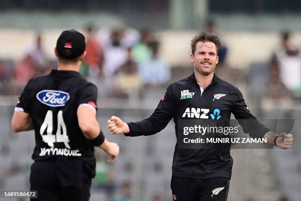 New Zealand's captain Lockie Ferguson celebrates aster the dismissal of Bangladesh's Mushfiqur Rahim during the third one-day international cricket...