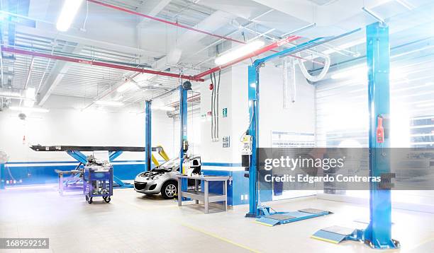 red and blue car racing - body shop nobody stock pictures, royalty-free photos & images