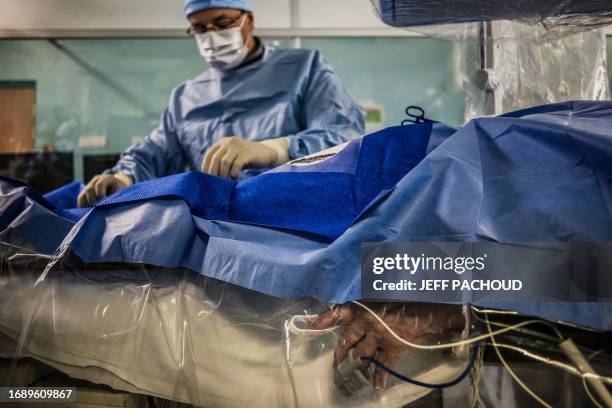 Surgeon prepares to performing electroporation, a promising technique against artery fibrillation, on a patient suffering from a heart rhythm...