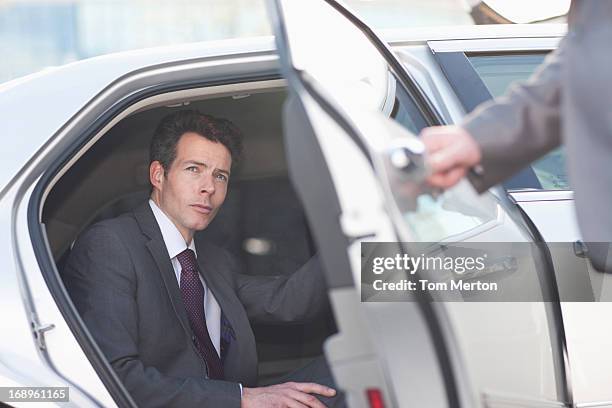 politician emerging from limo - world premiere red carpet arrivals stock pictures, royalty-free photos & images