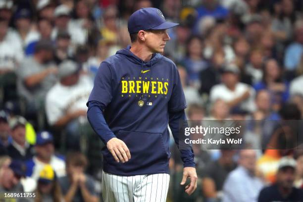 Craig Counsell of the Milwaukee Brewers walks onto the field to talk with an umpire during the fourth inning against the Washington Nationals at...