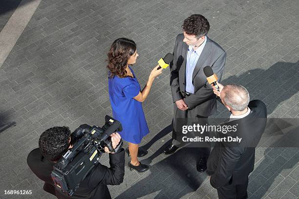 politician talking to reporters - politician interview stock pictures, royalty-free photos & images