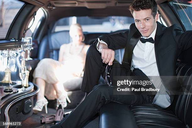 couple in limo - man sitting inside car stock pictures, royalty-free photos & images