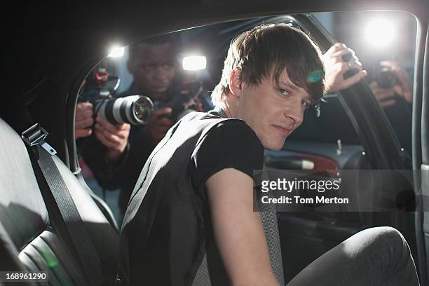 man exiting limo - limo stockfoto's en -beelden