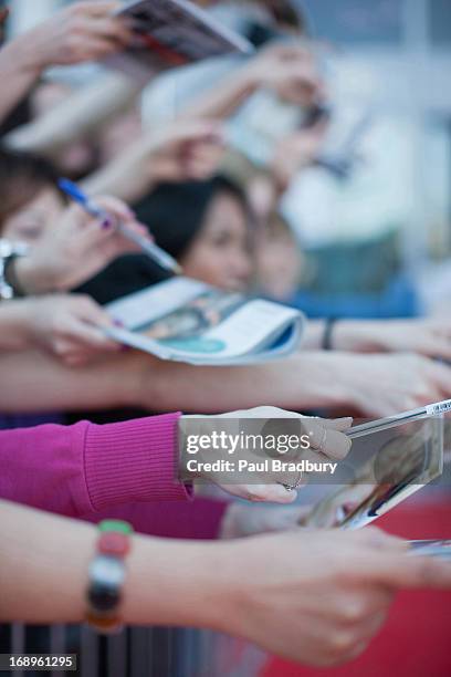 fans trying to get autographs - rush world premiere red carpet arrivals stock pictures, royalty-free photos & images