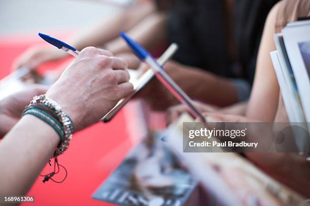 fans trying to get autographs - rush world premiere red carpet arrivals stock pictures, royalty-free photos & images