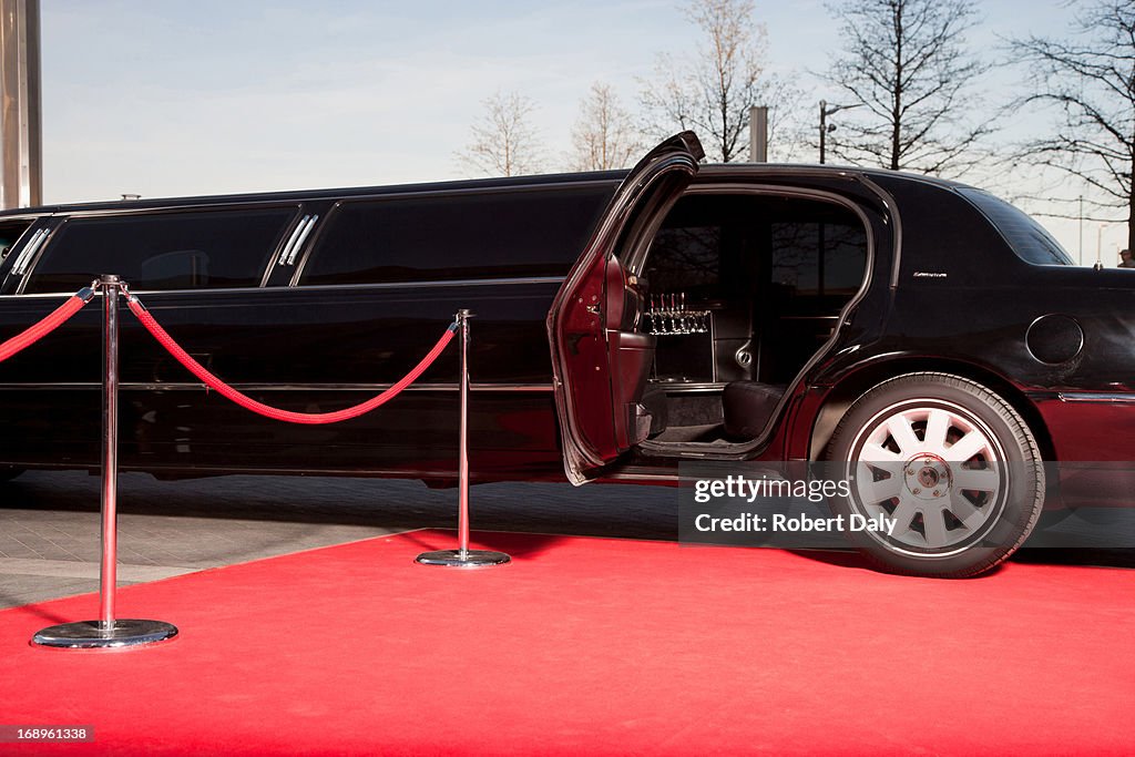 Limo with open door on red carpet