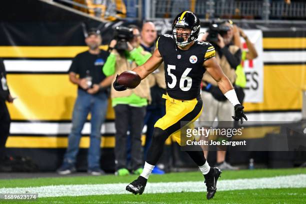 Alex Highsmith of the Pittsburgh Steelers celebrate after scoring a touchdown on an interception against the Cleveland Browns during the first...